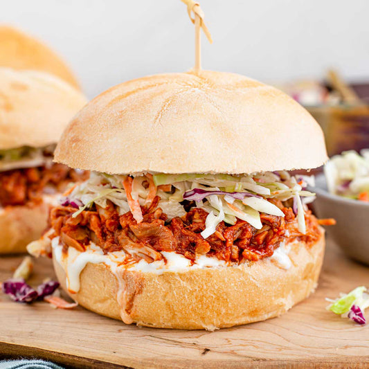 Bbq Pulled Jackfruit Sandwich on Vegan Bun With Apple Cider Slaw Side Garden Salad